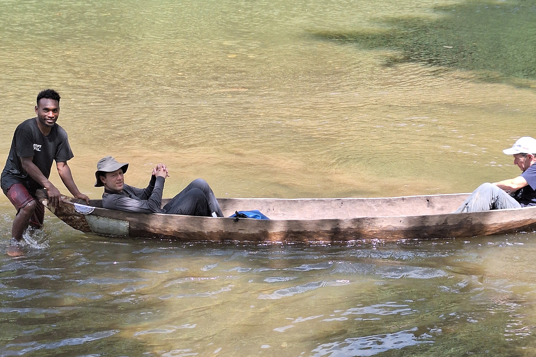 Crossing one of the many river sections in a hand made canoe on Marika (image by Diedert Koppenol)