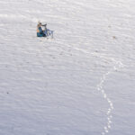 A local guide searching for Snow Leopards (image by Mark Beaman)